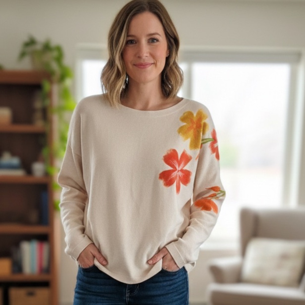 Aaeda beige long sleeve sweater with a raised flower design